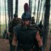 Odysseus and his army traverse through a sparse island forest